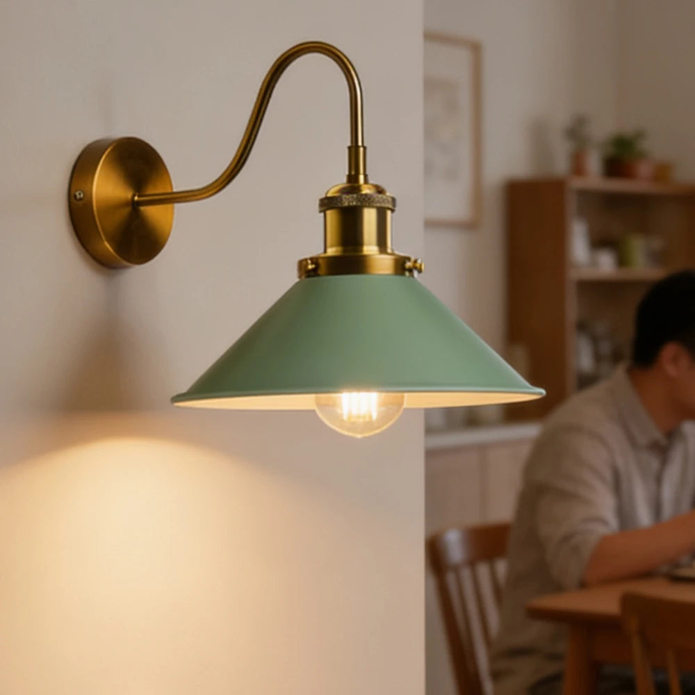 green brass wall sconce, front view on white background