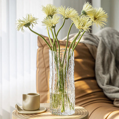 Smoky gray Style B glacier glass vase catching light on a marble surface