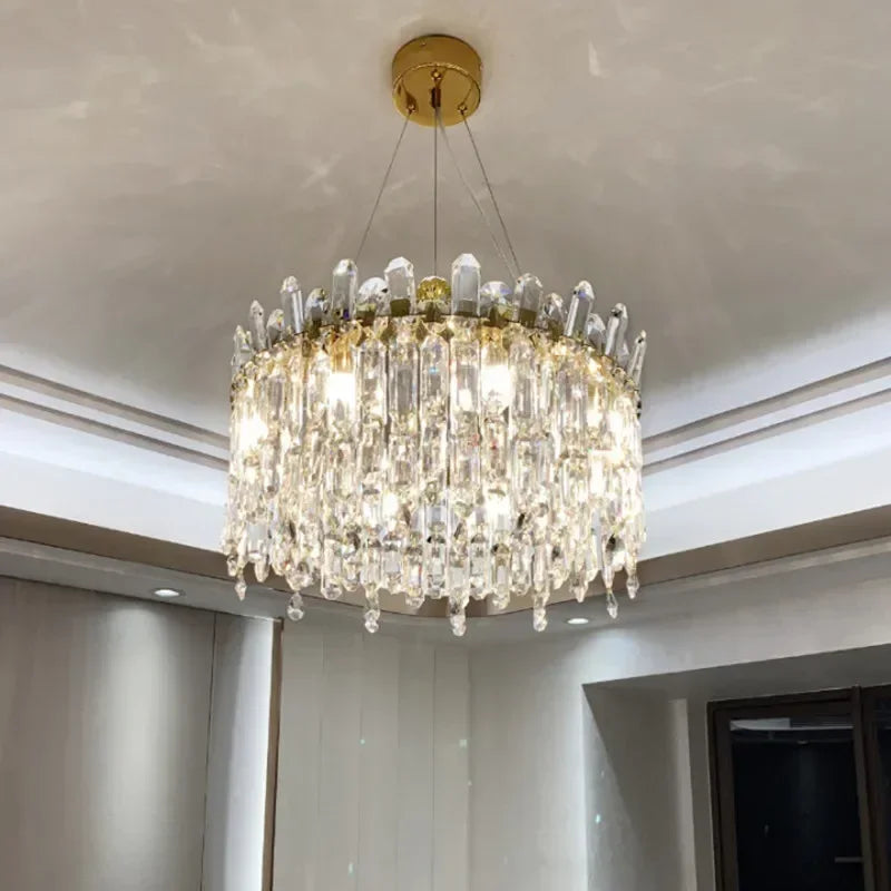 Crystal detail set into a brushed stainless steel chandelier band in gold