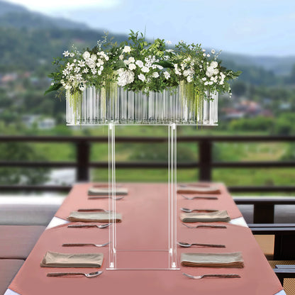 Clear crystal acrylic flower stand centrepiece with white rose arrangement at wedding reception