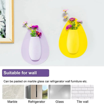 Pink silicone wall planter vase adhered to window