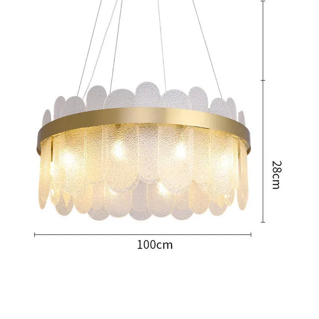 Frosted glass band on a gold chandelier body for a hotel style room