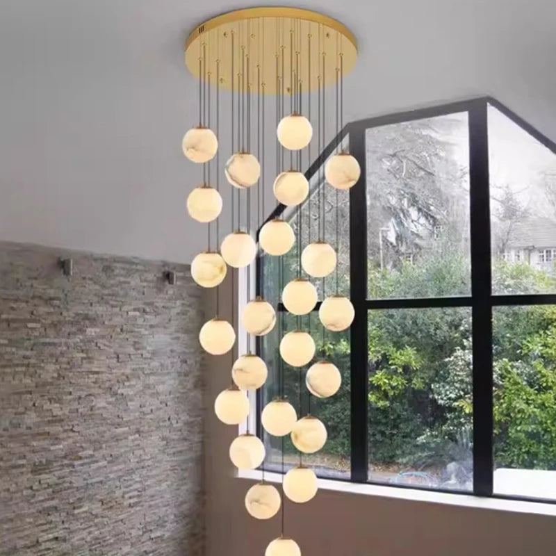 Minimalist acrylic rod chandelier with staggered lit rods on a gold frame