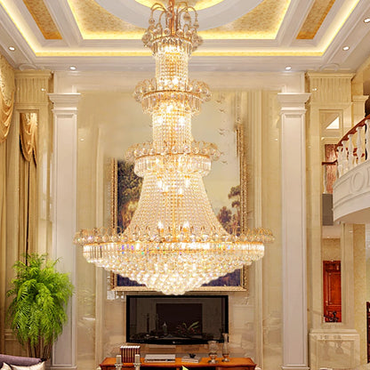 Four layer crystal chandelier, 47.2 in across, lit in warm light