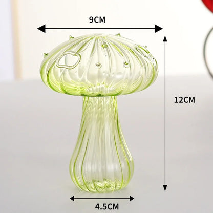 Transparent mushroom jelly vase with fresh flower on office desk