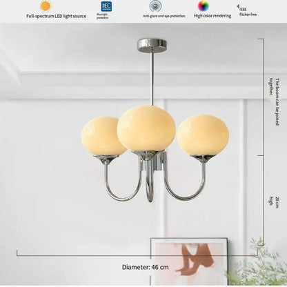 Silver finish glass ball chandelier with cream frosted globe shades