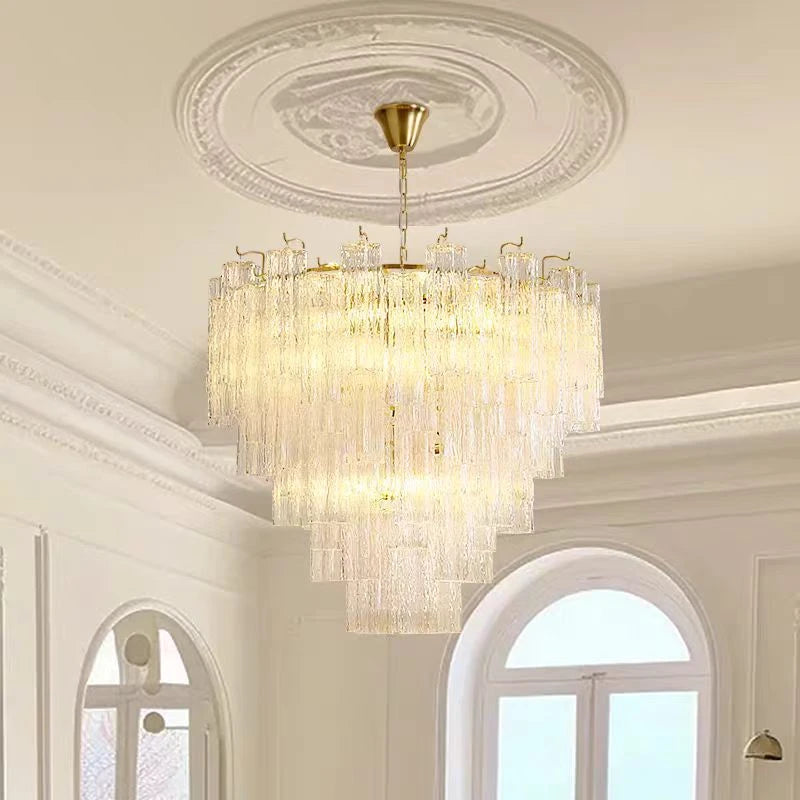 Stacked stained glass tiers casting light upward and down from a gold frame
