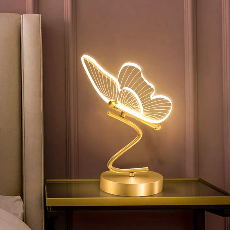 Nordic butterfly LED table lamp EU plug front view switched on warm light