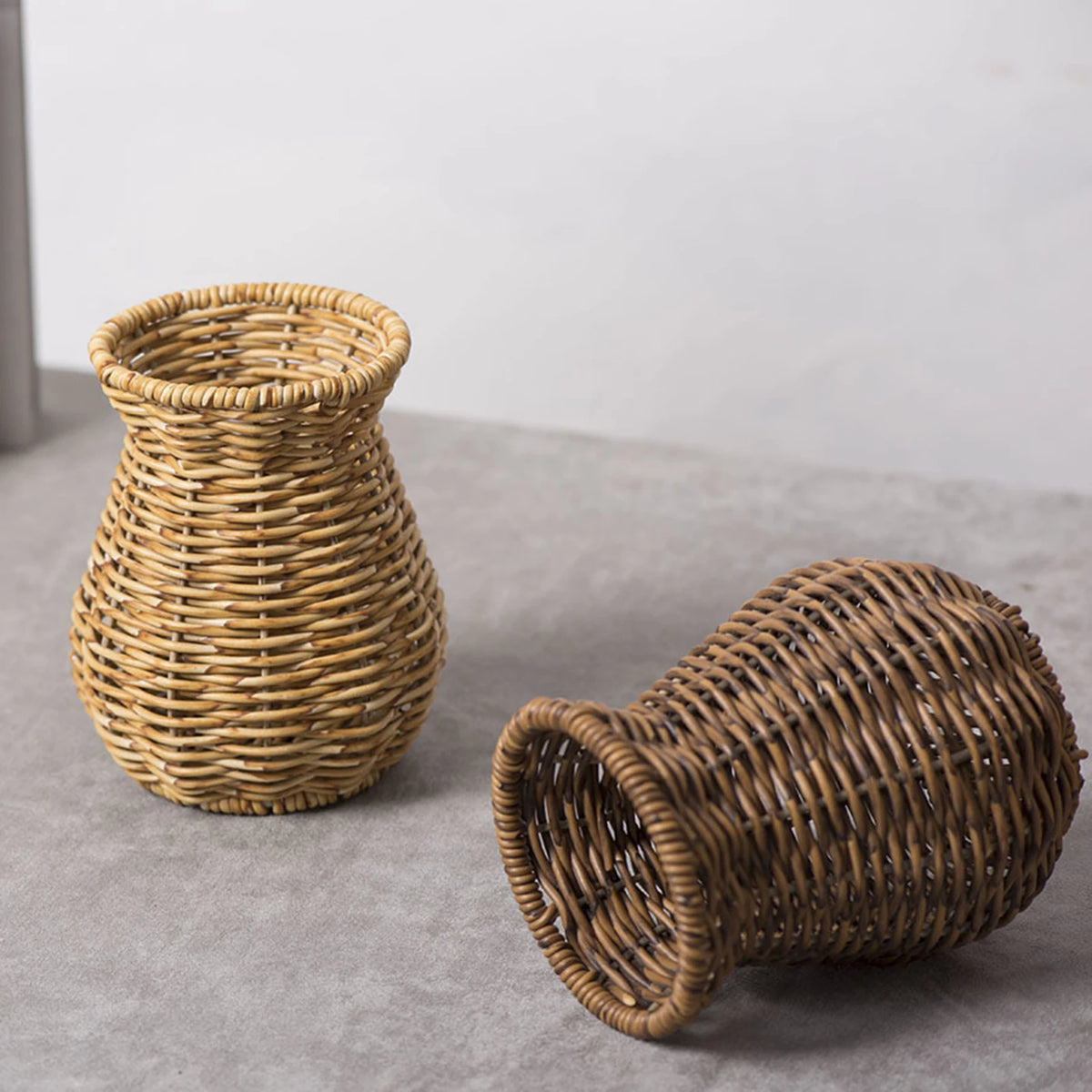 Style E handwoven rattan flower vase with dried cotton stems on a shelf vignette
