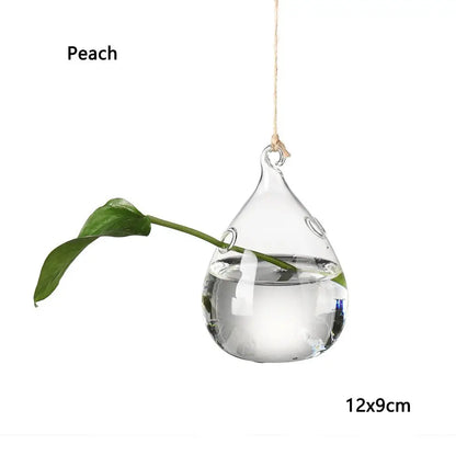 Close-up of bird shaped glass hanging hydroponic vase