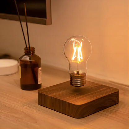 Maglev glass table lamp in dark room showing levitating illuminated bulb