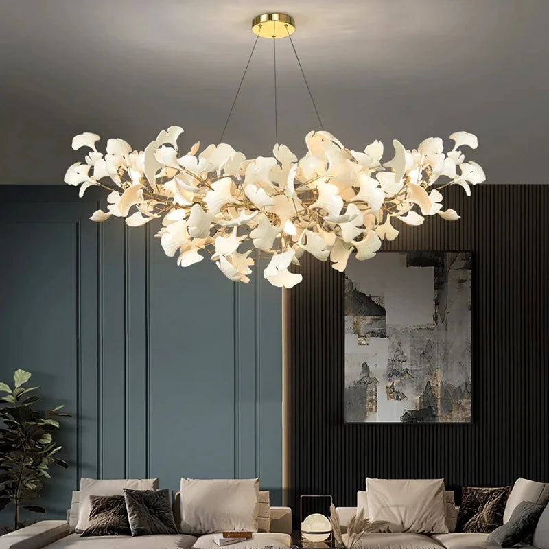Ceramic ginkgo leaf chandelier with gold iron arms and sculpted white leaves