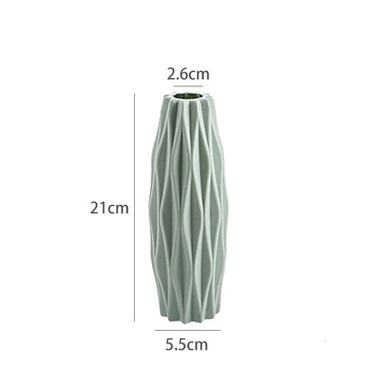 Light pink boho plastic vase angled view showing full height and color