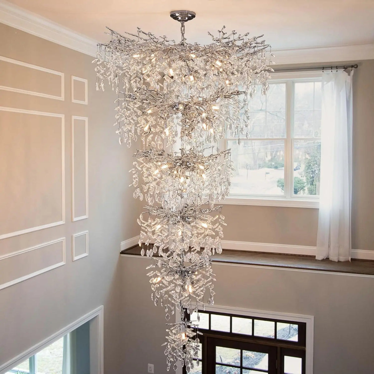 Chrome crystal stairway chandelier falling as a long polished column