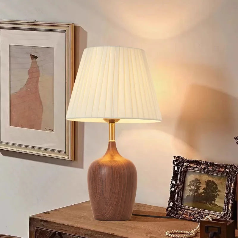 Overhead view of walnut vase lamp shade with diffused warm light