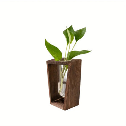 Minimalist wood hydroponic propagation vase with glass vessel and plant cutting