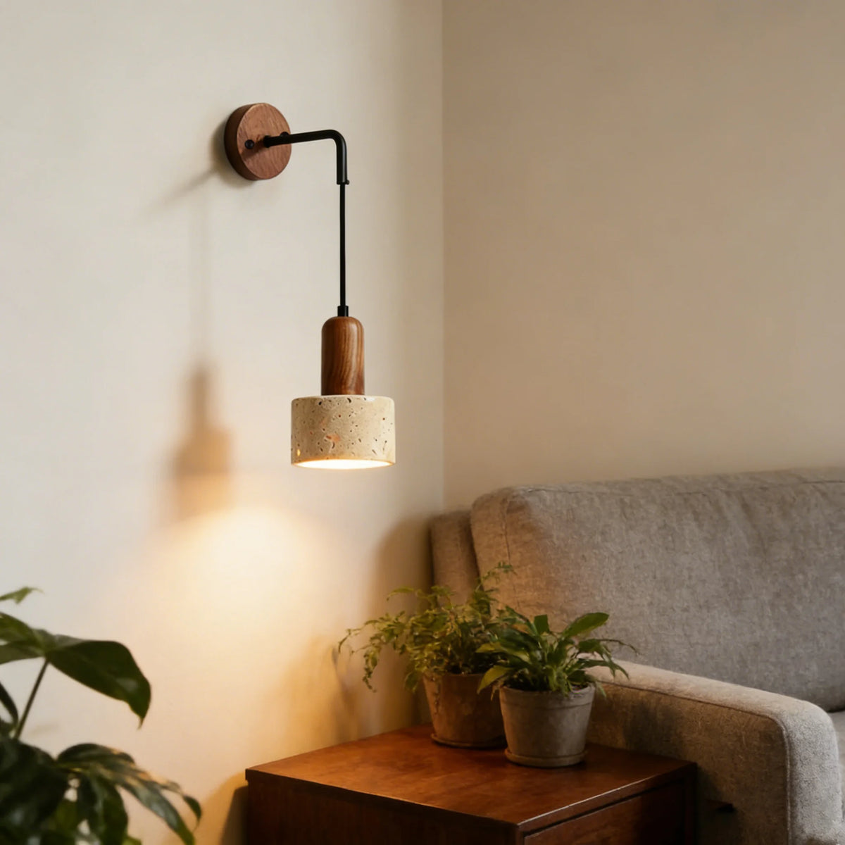 black travertine stone wall sconce, side profile showing mounting depth