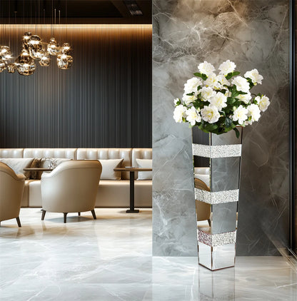 Polished mirrored crystal vase reflecting light in Hollywood Regency interior