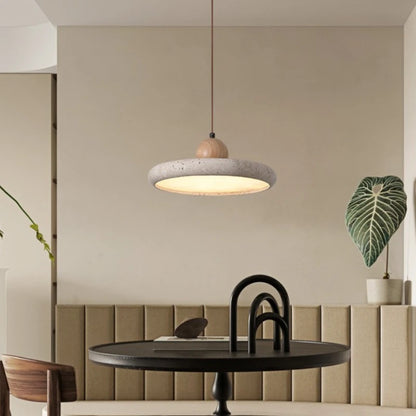 Yellow travertine shade chandelier on a slim iron cord fitting