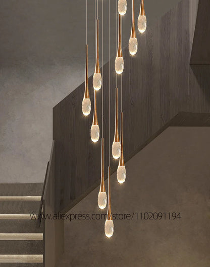 Polished crystal staircase chandelier with slim crystal rods on a gold frame