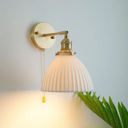 brass wall sconce, installed in a room interior setting