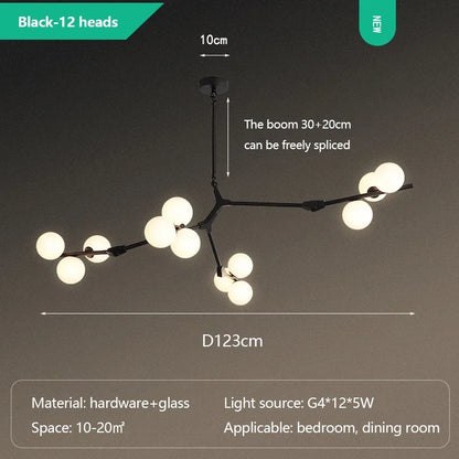 Glass ball branch chandelier shown lit in warm G9 LED light