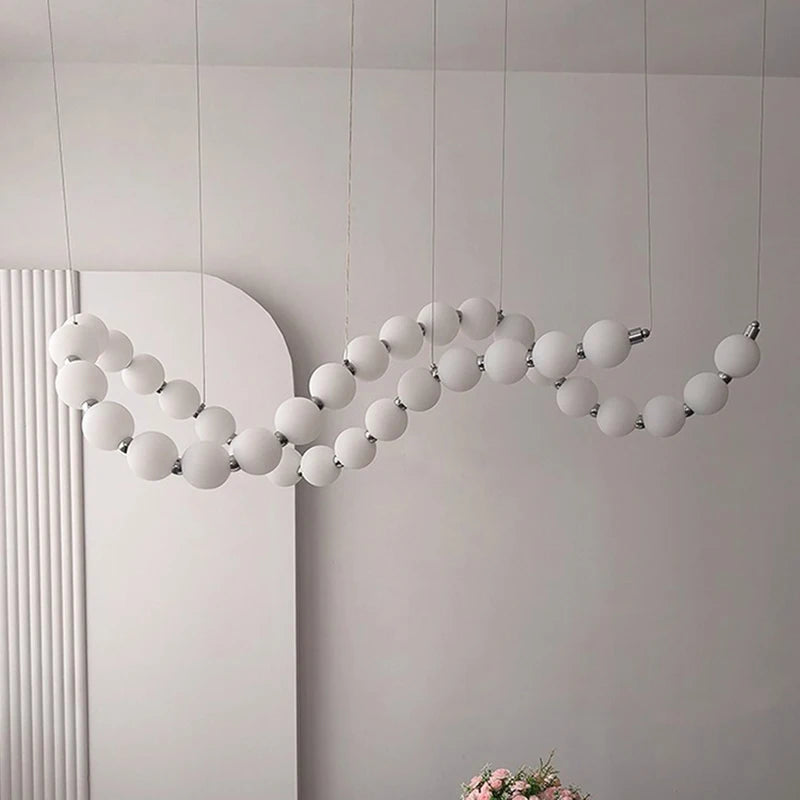 Minimalist linear strip chandelier with an acrylic diffuser bar