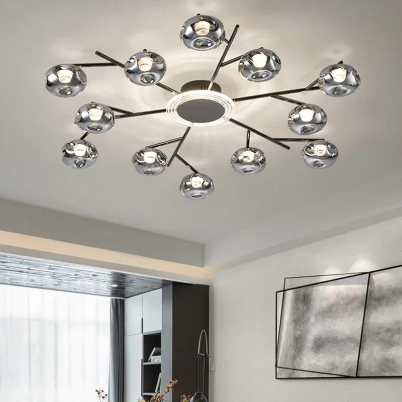 Glass ball chandelier with eight clear globes on slender gold arms