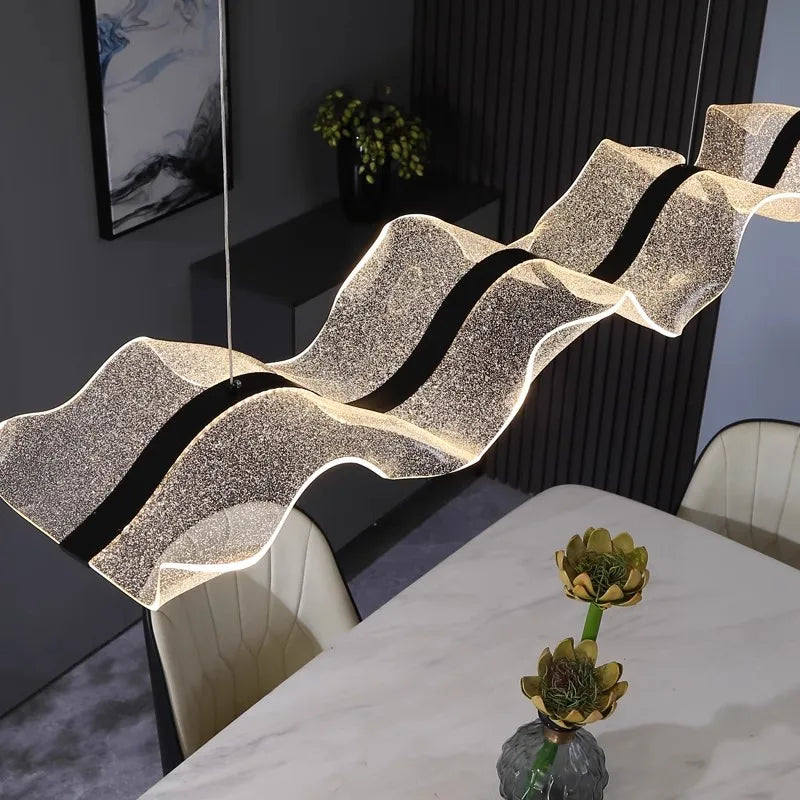 Minimalist PMMA bar chandelier in cold white light over a long table