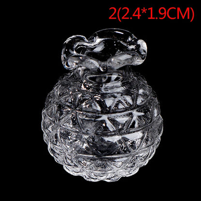 Miniature glass vases in 1:12 scale shown alongside dollhouse furniture
