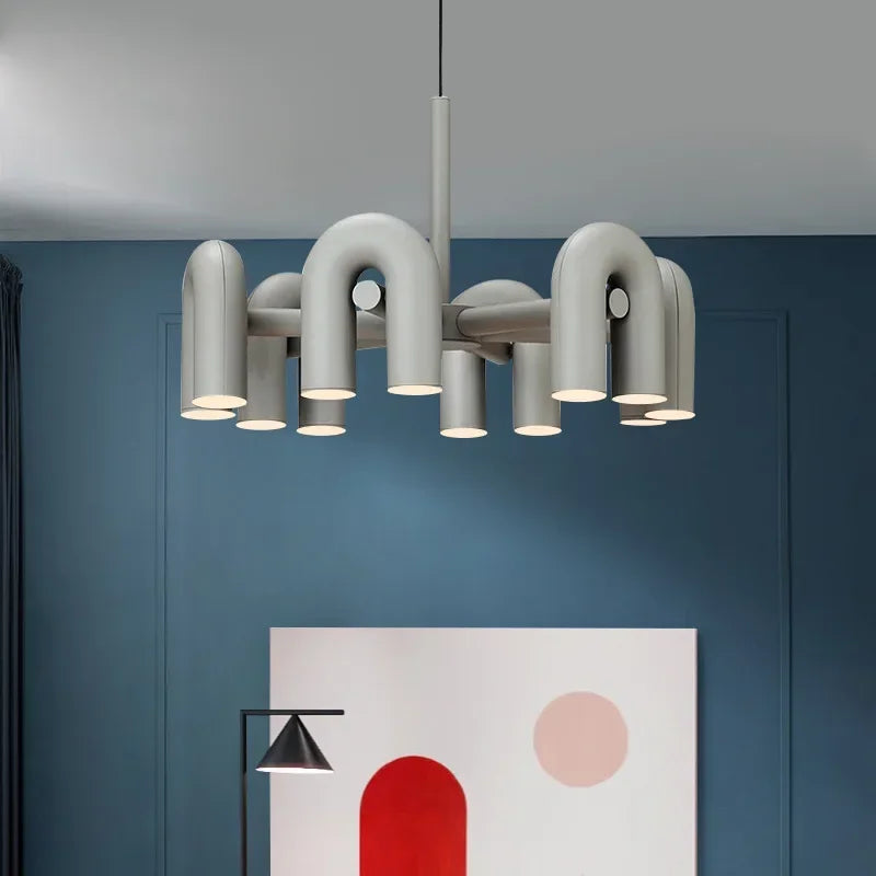 Minimalist U shaped chandelier with slim iron arms stacked in a group