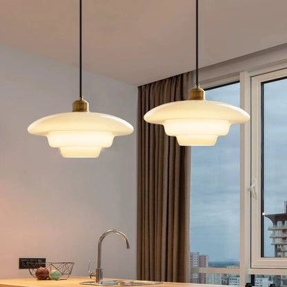 Formed milk glass chandelier shade with a gently irregular curve