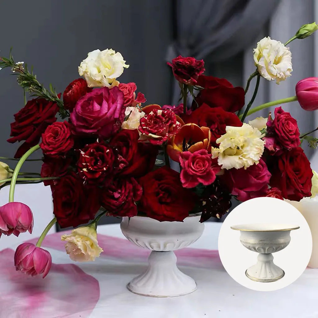Gold metal wedding vase with white roses and pillar candle arrangement