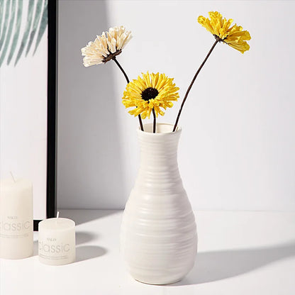 Three Nordic plastic bud vases side by side showing style color comparison