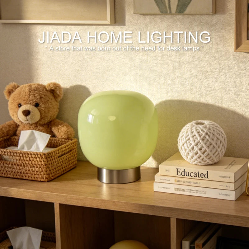 Mochi Glow pink variant soft LED lamp glowing on bedroom shelf