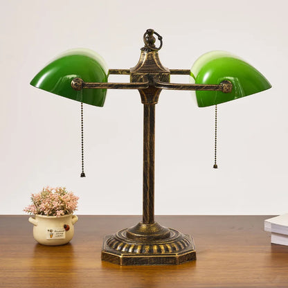 Green banker lamp shade close-up showing classic green glass dome