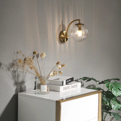 glass wall sconce, installed in a room interior setting