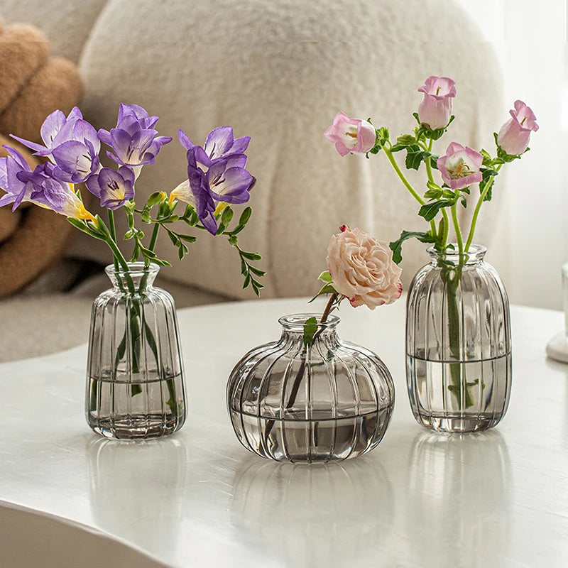 Aesthetic glass vase with flower arrangement Scandinavian shelf