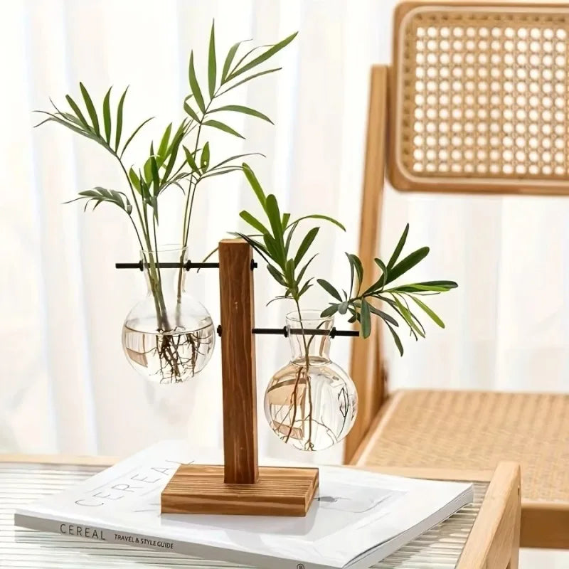 Clear glass planter tubes on minimalist wooden frame for home desk display