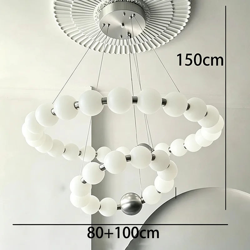 Silvery two ring chandelier, 31.5 and 39.4 in across, on cords