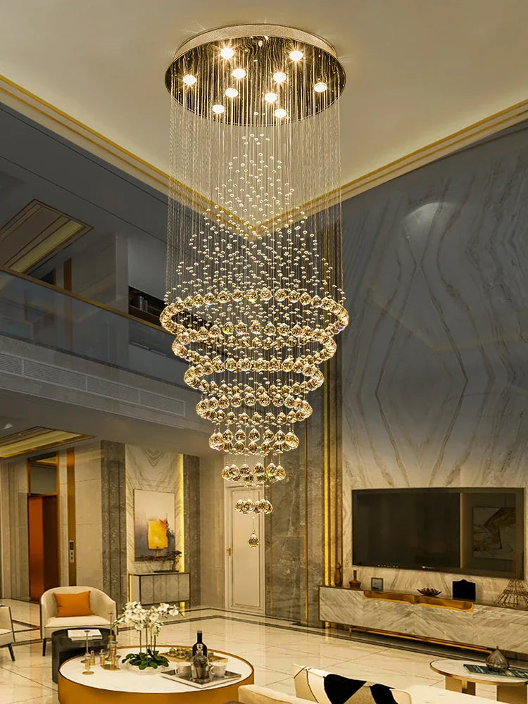 Long staircase chandelier in gold metal with a 98.4 inch drop and ten lights