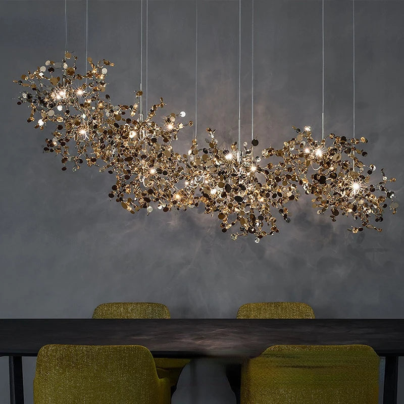 Steel chandelier with three heads in a long row in titanium gold