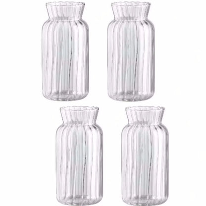 Striped glass mini vase collection arranged on eclectic home shelf