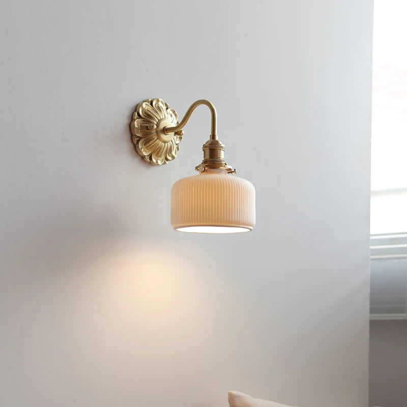 copper bathroom wall sconce, installed in a room interior setting