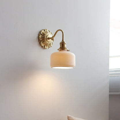 copper bathroom wall sconce, installed in a room interior setting