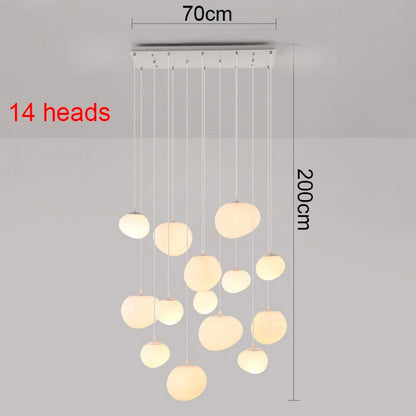 Acrylic chandelier heads suspended from a round chassis on cords