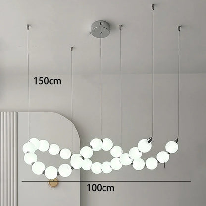 Gold strip chandelier at 49.2 in length for a kitchen counter