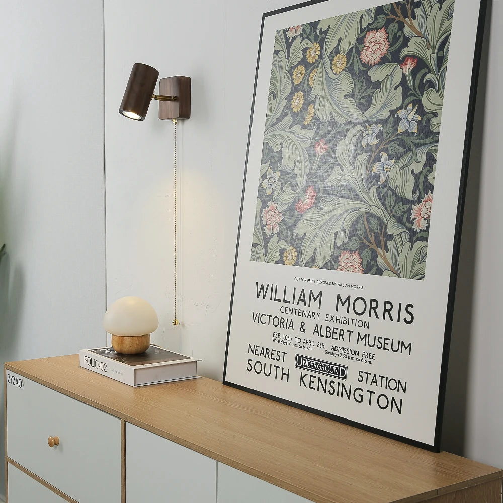 walnut wood wall sconce, detail view of fixture base and arm