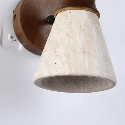 travertine stone wall sconce, detail view of fixture base and arm