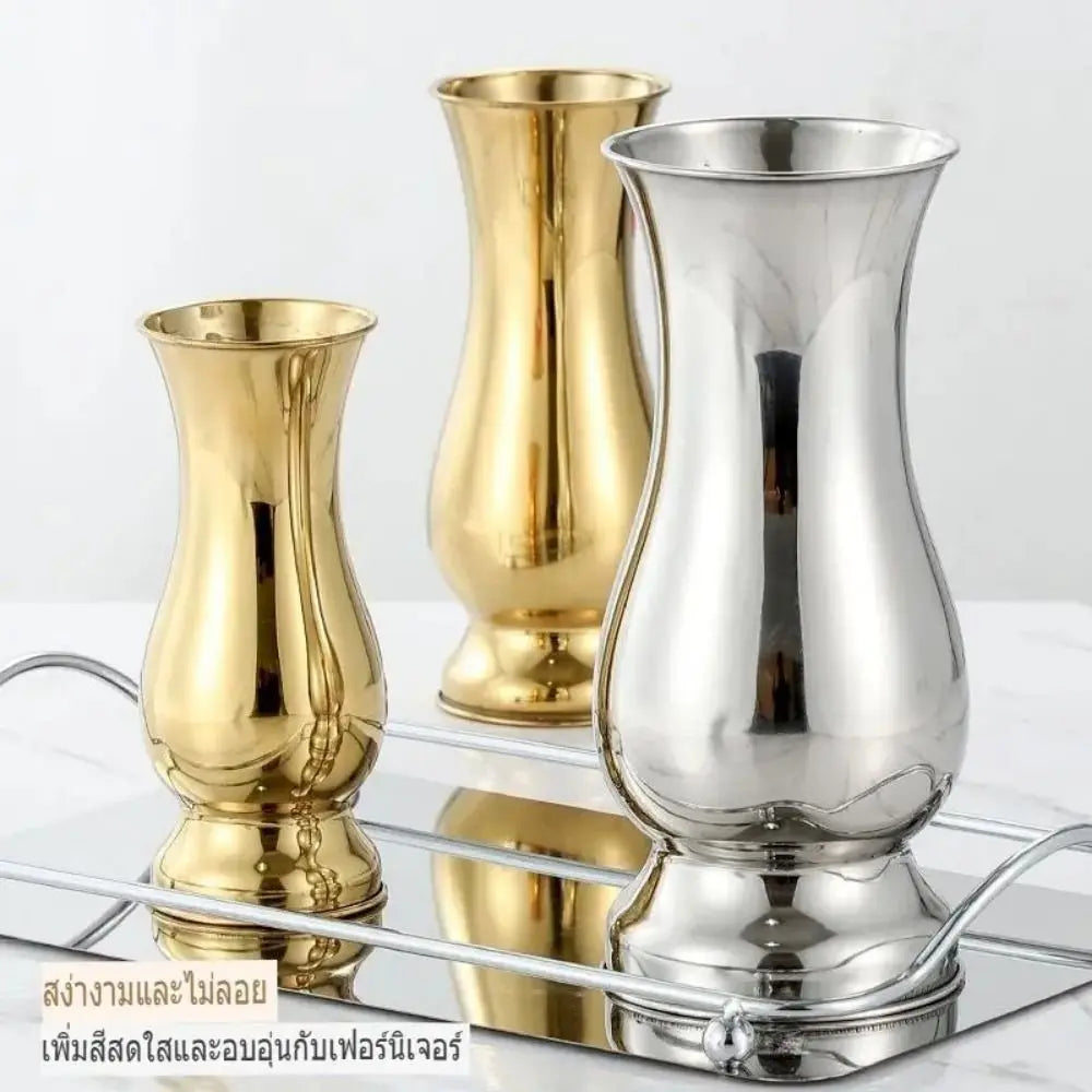 Silver stainless steel single stem vase on minimalist white table display